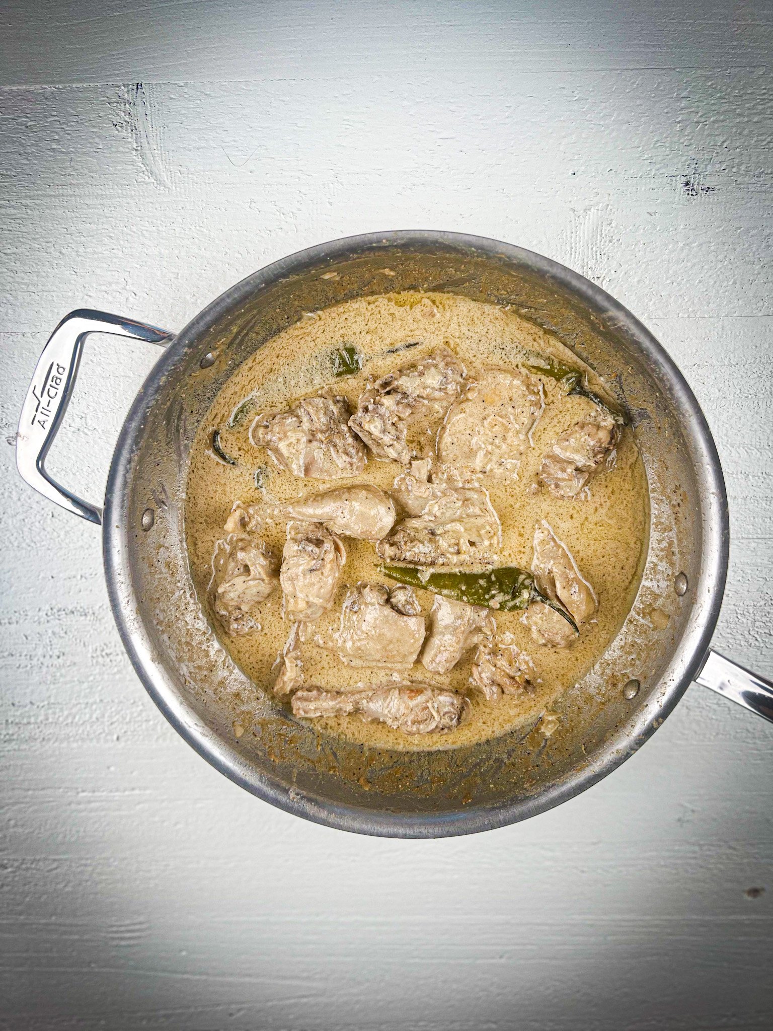 white chicken karahi in a pot.