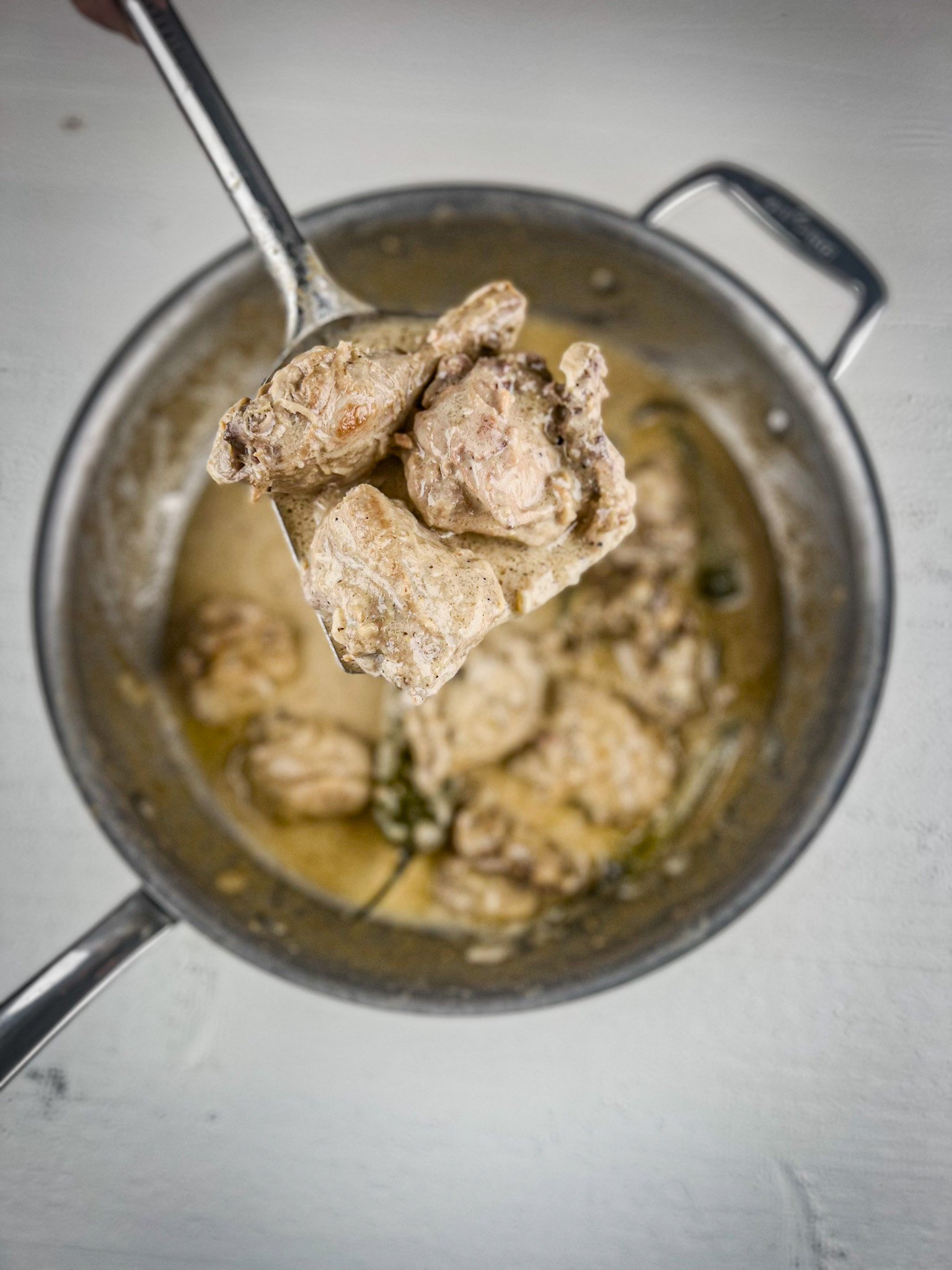 white chicken karahi in a pot.